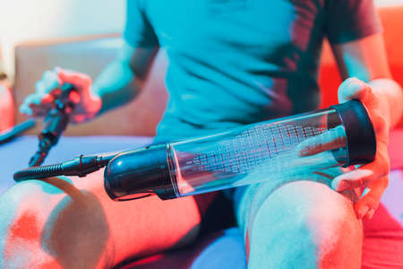 The buyer considers the hydropomp for penis cardio training.の写真素材