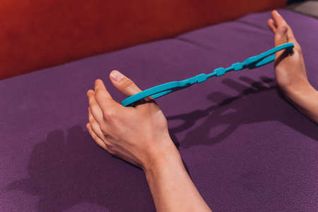 male and female hand in handcuffs. couple in bed. sex Toys.の写真素材