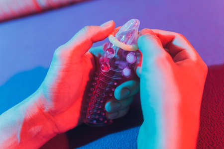 Sex toy - white penis sleeve on red background.の写真素材