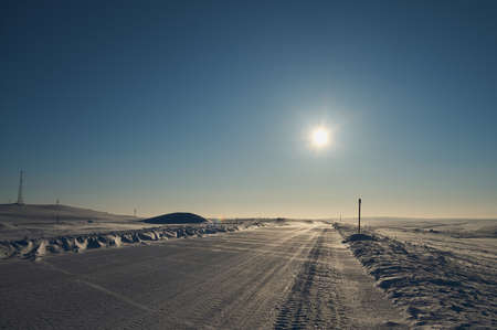 snow desert and the tracks of the car in the snow.