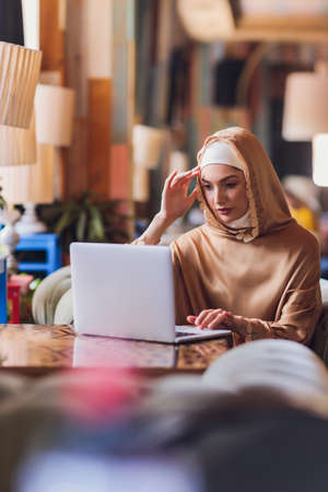 Beautiful Arabic business woman working on computer.の写真素材