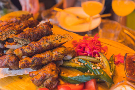 traditional Georgian lula kebab with three types sauce - ketchup, green tkemali, mayonnaise. Selective focused.の写真素材