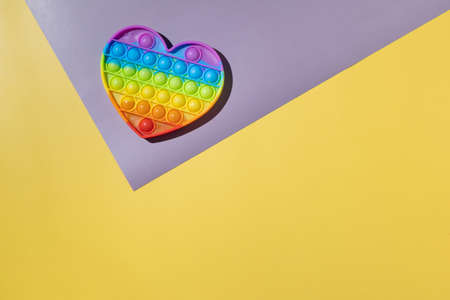 colorful antistress sensory toy fidget push pop it on background.の写真素材