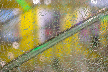 Shattered glass of a shop window display.