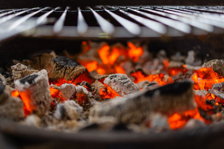 Stock image of charcoal fire grill, close up with live flames.の写真素材