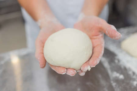 Close up of woman Kneading Pizza Dough
