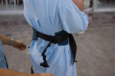 Mother and baby in backpack. Outdoor mount.