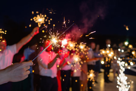 Picture showing group of friends having fun with sparklers.の写真素材