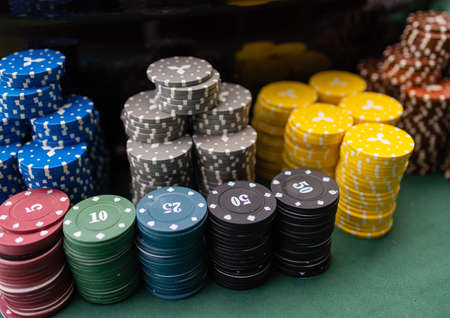 A close up of a blackjack dealers hands in a casino, very shallow depth of field.の写真素材