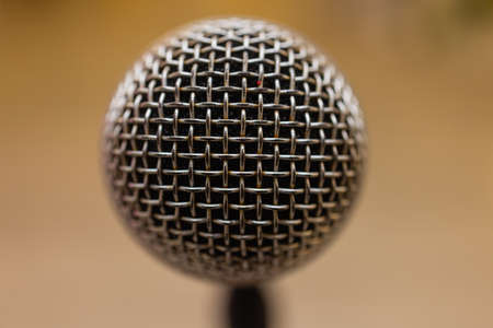 Close up of microphone over abstract blurred of attendee in seminar room or conference hall.の写真素材