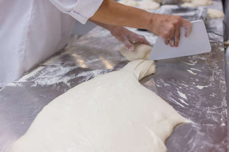 Close up of woman Kneading Pizza Dough.の写真素材