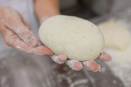 Close up of woman Kneading Pizza Dough.の写真素材
