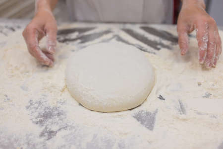 Close up of woman Kneading Pizza Dough.の写真素材
