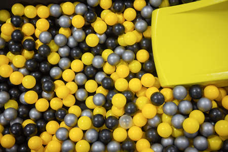 Many colour plastic balls from childrens small town.holiday, childrens party, a games room, a box filled with small colored balls.の写真素材
