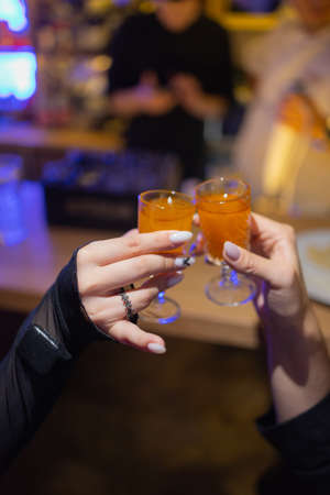 Celebration. People holding glasses of white wine making a toast.の写真素材