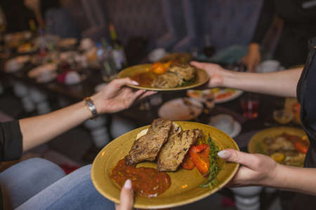 Grilled Steak Striploin and Pepper sauce on cutting board on dark wooden background.の写真素材
