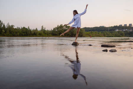 Outdoors fashion photo of beautiful bohemian lady at river.