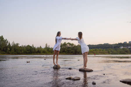 Outdoors fashion photo of beautiful bohemian lady at river.の写真素材