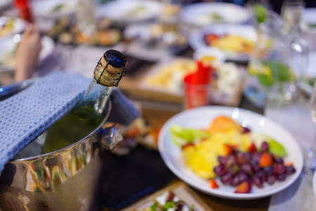 Dinner table with snacks decorated with beautiful summer flowers. Food Table Healthy Delicious Organic Meal Concept. Waiting for the guest.の写真素材