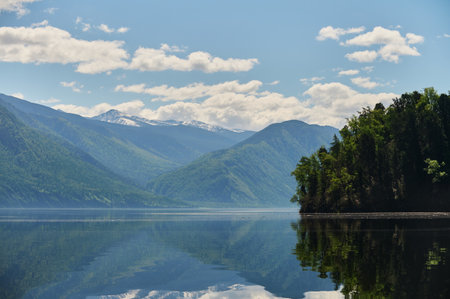 Landscape with boats in the water lake with views of the mountains. Teletskoye Lake Altai in Siberia.の写真素材
