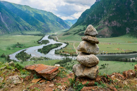 Fog in the mountain valley. Morning fog over the lake in the Altai mountains.の写真素材