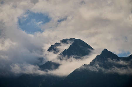 Fog in the mountain valley. Morning fog over the lake in the Altai mountains.の写真素材