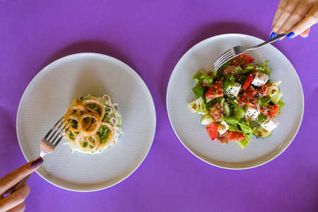 table with many salad top view. Different salads on concrete table, top view. Vegetable salad, Salad with smoked salmon, ceviche and stracciatella.の写真素材