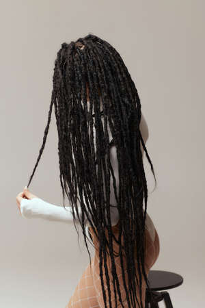 a young woman with afrokos black on white background.