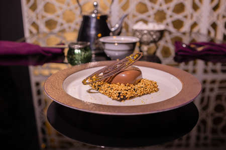 Chocolate brownie with vanilla ice-cream and chocolate sauce.の写真素材