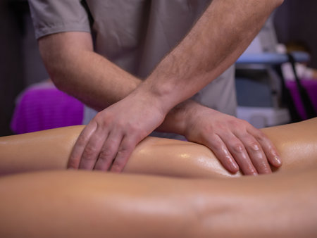 relaxing pain. fabulous full foot massage.close up side view cropped photo.の写真素材