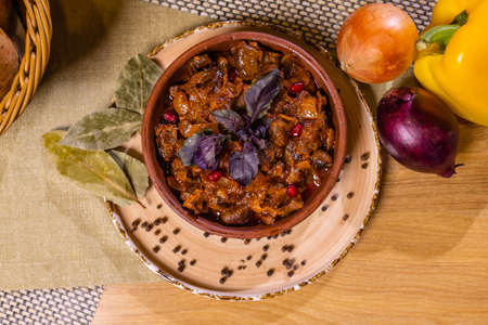 Recipe Ajapsandali stew of eggplant, onions, tomatoes and sweet peppers close-up in a bowl on the...