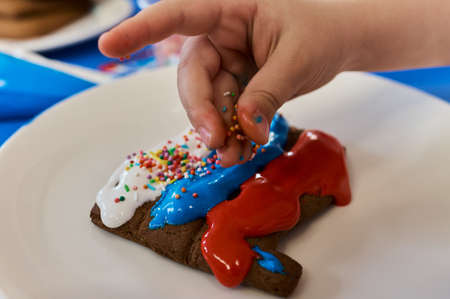 Christmas homemade gingerbread cookies on wooden table.