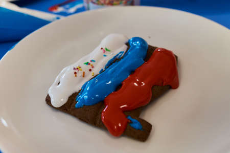 Christmas homemade gingerbread cookies on wooden table.