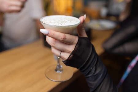 Celebration. People holding glasses of white wine making a toast.の写真素材