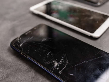 Broken mobile phone screen, black, white, clipping path. Smartphone monitor damage mock up. Cellphone crash and scratch. Telephone display glass hit. Device destroy problem. Smash gadget, need repair.の写真素材