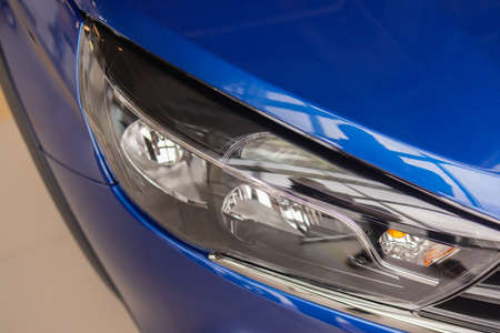 modern car in reflections on blue metallic.の写真素材