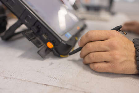 Professional car mechanic working in auto repair service.の写真素材