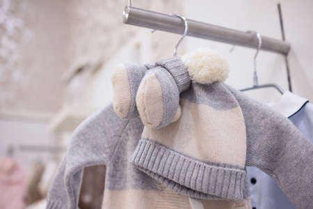 closeup of baby clothes on rack in a flea market.の写真素材