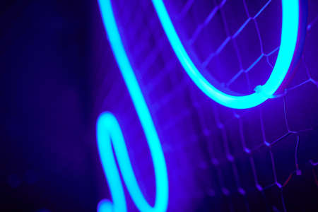 Abstact red neon sign with a blue neon tube.の写真素材