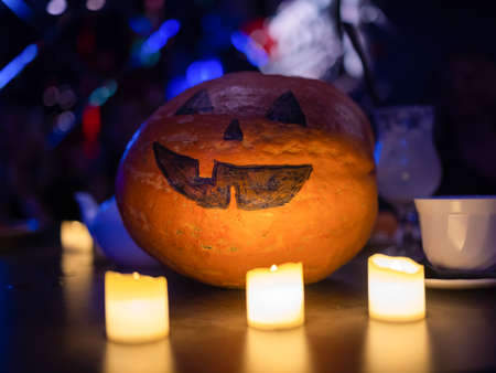 Halloween Pumpkins And Candles On Wooden close-up.の写真素材