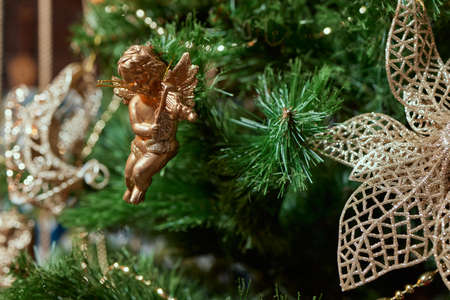 Fir branch with balls and festive lights on the Christmas background.の写真素材