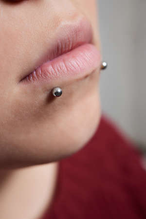 Professional holding the jewel of piercing day just before screw the ball. Tragus type.の写真素材