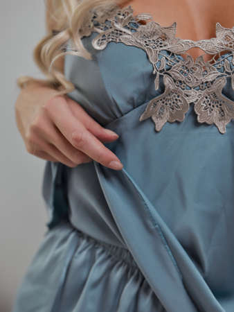 young woman in nightie pajamas at home.の写真素材