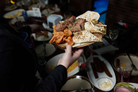 Turkish traditional kebab Ali Nazik on rustic wooden table.の写真素材