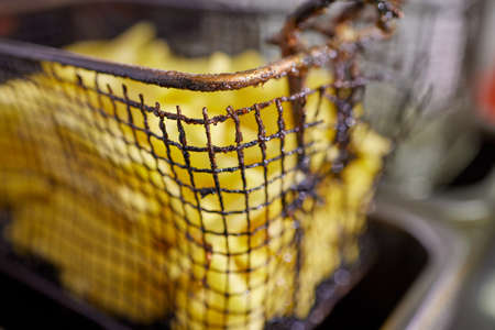 Dirty cooking area with french fries deep fryer.の写真素材
