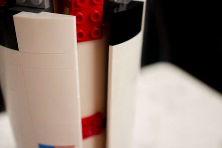 assembling a rocket constructor. colored plastic small blocks.の写真素材
