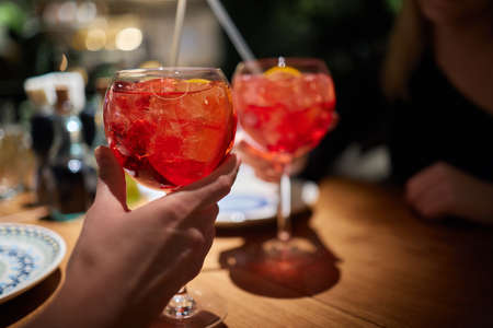 Italian cocktail with orange slices on gray stone table. Summer drink, homemade.の写真素材