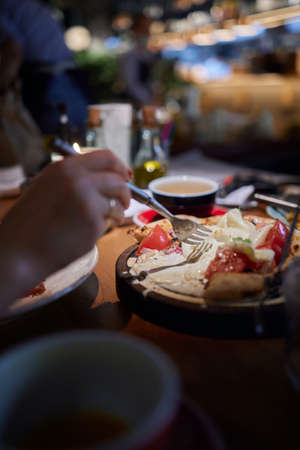 Caprese salad with tomatoes, mozzarella cheese, basil. Dark background. Close up. Top view.の写真素材