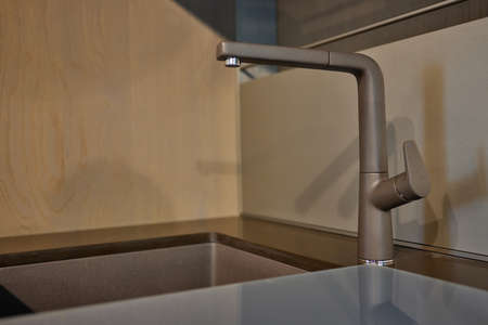 Kitchen water mixer. Water tap made of chrome material.