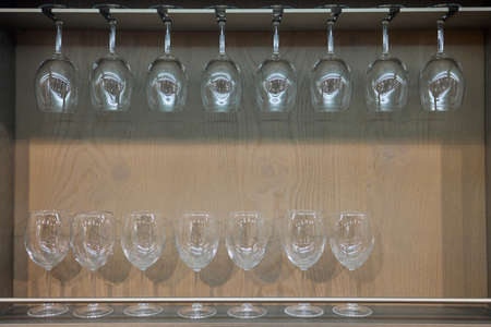 Storing bottles of wine in fridge. Alcoholic card in restaurant. Cooling and preserving wine.